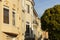 A row of beige upscale houses against blue sky