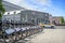 A row of bicycles in the parking lot and the building of the Art Theater in Moscow. Caption: New Order. Art theater