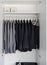 Row of black and grey shirts hanging on coat hanger