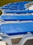 Row of Blue Vinyl Chaise Lounges