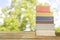 Row of books against nature background,