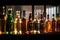 A row of bottles of alcoholic drinks on a bar counter in blur. Generative AI