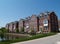 Row of Brick Condos With Bay Windows