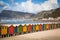 Row of brightly colored huts in Muizenberg beach. Muizenberg