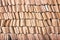Row of brown clay roof tiles patterns texture or background