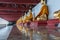 Row of buddha sculptures in a temple corridor