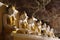 Row of Buddha statues in sacred Yathaypyan Cave in Hpa-An, Myanmar