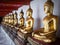 Row of Buddha Statues at Wat Pho Temple, Bangkok, Thailand