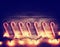 A row of candy canes and christmas lights toned with a retro vintage instagram filter effect