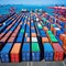 a row of cargo containers ready for with a busy shipping pier as the Embodying the seamless logistics and extensive reach