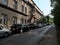 A row of cars parked on the side of the road. Deserted street of a small eastern