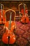Row of cellos in a room