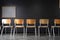 a row of chairs in a classroom, with a chalkboard and whiteboard behind them