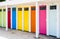 Row of changing cubicles with colorful doors at the beach