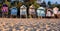 Row of characterful, colourful beach huts on the sea front at Wells-next-the-Sea, North Norfolk UK. Photographed at golden hour.