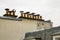 Row of Chimney Pots atop a Parisian Building
