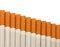 Row of cigarettes on white background