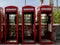 Row of Classic Red British Telephone Boxes