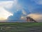 Row of coconut trees On the walk in the rice field at Thai countryside, Beautiful clouds and sunshine With the concept of rural li