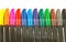 Row of colored marker pen tops
