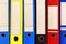 A row of colorful account files in company