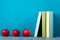 Row of colorful books, grungy blue background, free copy space