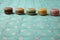 Row of colorful delicious macarons on a tablecloth