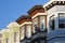 Row of colorful historic buildings with bay windows in San Franc