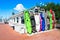 A row of colorful kayaks standing upright against a building at a marina in Islamorada, Florida