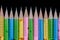 Row of colorful sharpened pencils tip