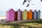 Row of colorful wooden beach huts on the beach in island oleron france