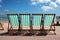 Row of colourful deckchairs on Weymouth beach