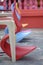 Row of colourful plastic chairs