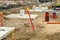 Row of concrete footings for steel columns at the construction site of a new industrial building