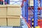 row of cotton boxes kept in warehouse shelves