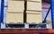 row of cotton boxes kept in warehouse shelves