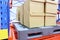 row of cotton boxes kept in warehouse shelves