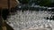 Row of crystal wine and champagne glasses standing on banquet table