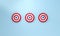 Row dart hitting target on blue background. Bullseye success concept