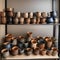 A row of decorative, handcrafted ceramic mugs on a shelf in a pottery shop1