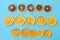 Row of dehydrated citrus fruits as lemons, tangerines, oranges on blue background