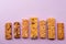 Row of different granola bars on violet background