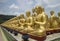 Row of disciple statues surrounding Big buddha statue