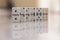 Row of dominos doubles in order fading into defocused background with reflection