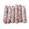 Row of dry smoked salami sticks close up for a snack on white background