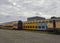 A row of Dutch Commuter Train Carriages stored at a Container Port and waiting for disposal and Recycling..