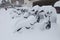 Row of electric bicycles Bicimad, buried in snow, Madrid