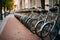Row of electric bikes parking in the city. Generative AI