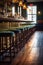 a row of empty bar stools at a stylish restaurant counter