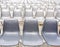 A row of empty gray chairs for outdoor cinema or auditorium
